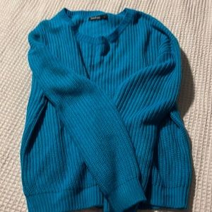 Thin sweater is a turquoise color